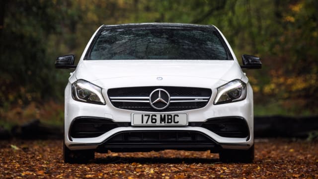 White Mercedes-Benz A-Class 2013-2018 parked in a wooded area